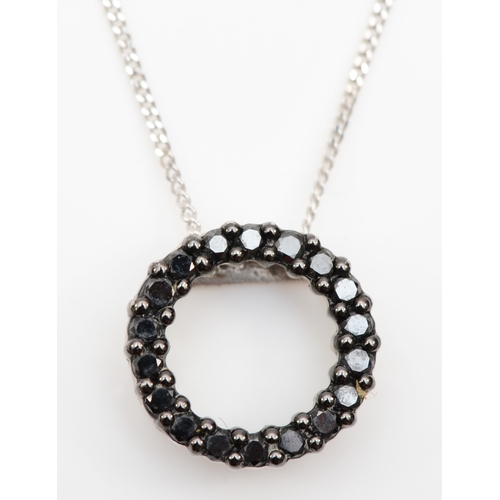 221 - A 14k white gold synthetic black diamond pendant on chain, 10mm, 2gm.