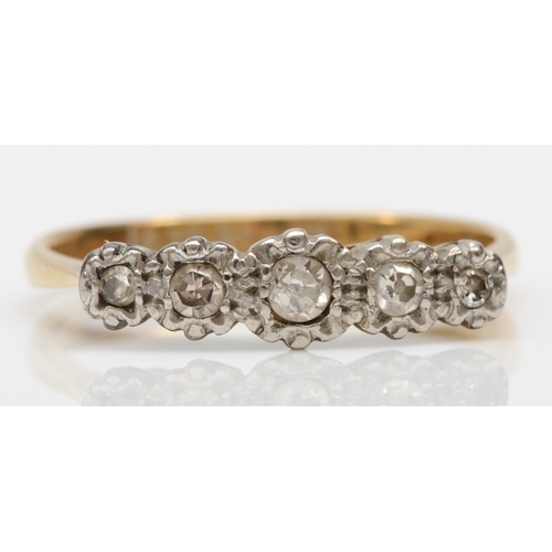 225 - An 18ct and platinum set five stone diamond dress ring, graduating illusion set brilliant cut diamon... 