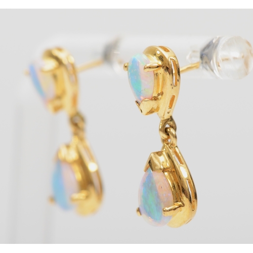 233 - A pair of 18k gold crystal opal drop earrings, 20mm, 3.1gm, lacking backs.