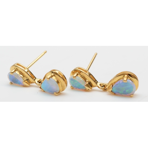 233 - A pair of 18k gold crystal opal drop earrings, 20mm, 3.1gm, lacking backs.