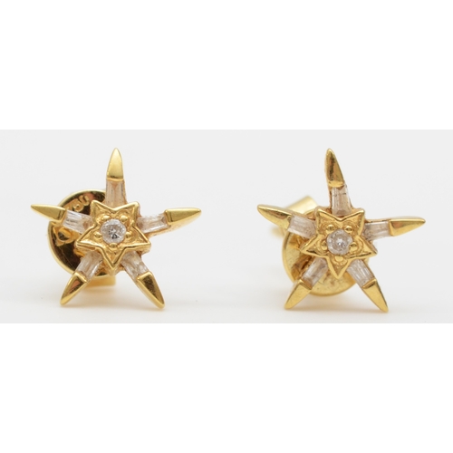 234 - A pair of 18k gold diamond star stud earrings, 8mm, 1.3gm.