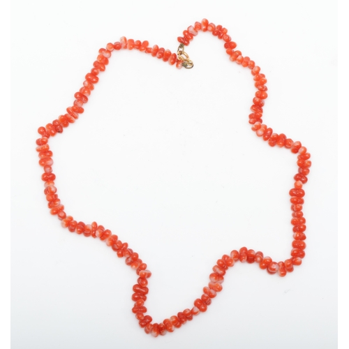 235 - A 750 gold clasped coral necklace, 41cm.