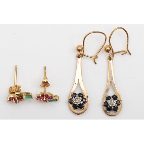 239 - A pair of 9ct gold sapphire drop earrings, 32mm, together with a pair of 9k gold ruby and emerald fl... 