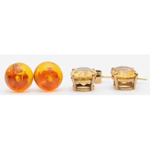 243 - A pair of 9ct gold citrine drop earrings, 18 x 9mm, together with a pair of Baltic amber stud earrin... 