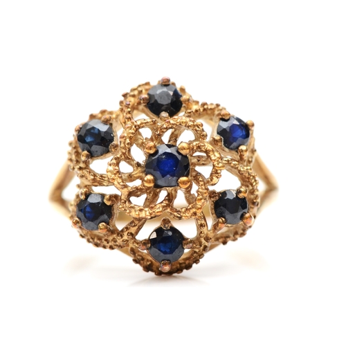 246 - A 9ct gold sapphire floral dress ring, O-P, 3.9gm.