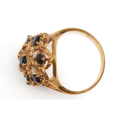 246 - A 9ct gold sapphire floral dress ring, O-P, 3.9gm.