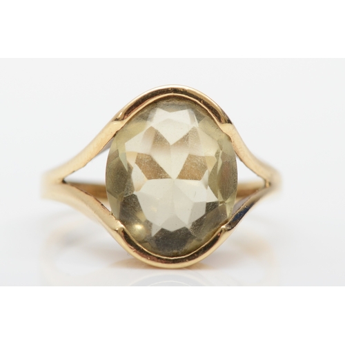 248 - A 9ct gold abstract citrine dress ring, N, 4.1gm.