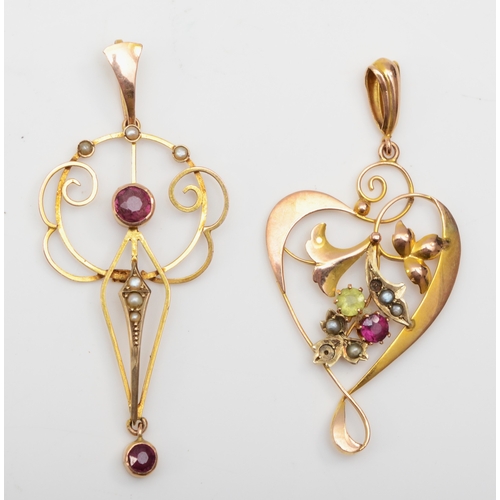 253 - Two Edwardian 9ct gold open work pendants set with garnet and seed pearls, 3.3gm.