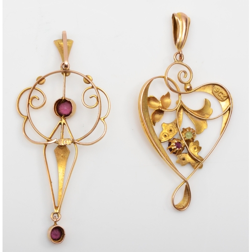 253 - Two Edwardian 9ct gold open work pendants set with garnet and seed pearls, 3.3gm.