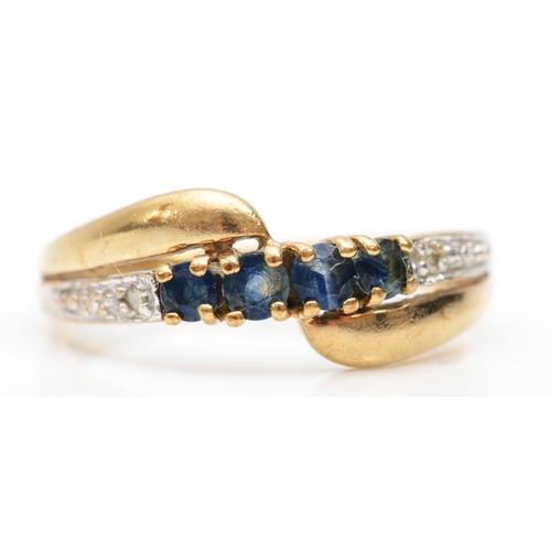 254 - A 9ct gold diamond and sapphire dress ring, L, 1.6gm.