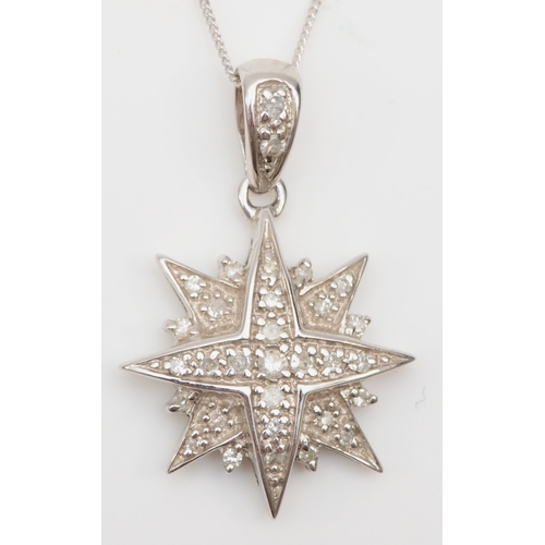 264 - A 9ct white gold diamond star pendant, on 375 gold chain, Sheffield 1994, stated diamond weight .15,... 