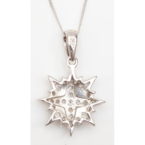 264 - A 9ct white gold diamond star pendant, on 375 gold chain, Sheffield 1994, stated diamond weight .15,... 