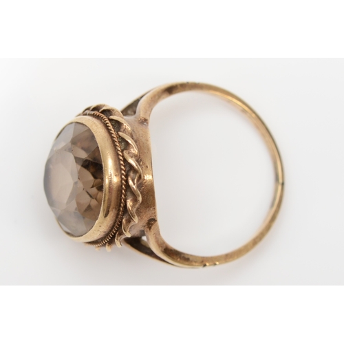 266 - A 9ct gold smokey quartz dress ring, 16 x 12mm, N-O, 5gm.