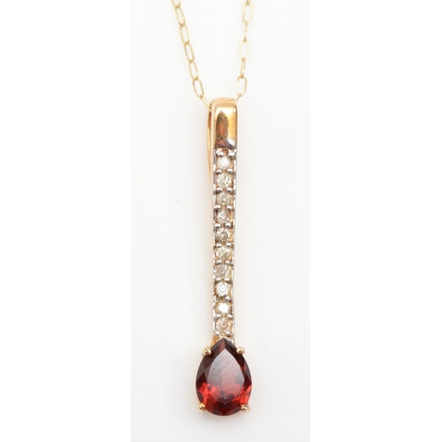 268 - An unmarked gold garnet and brilliant cut diamond drop pendant on chain, 28mm, 1.4gm.