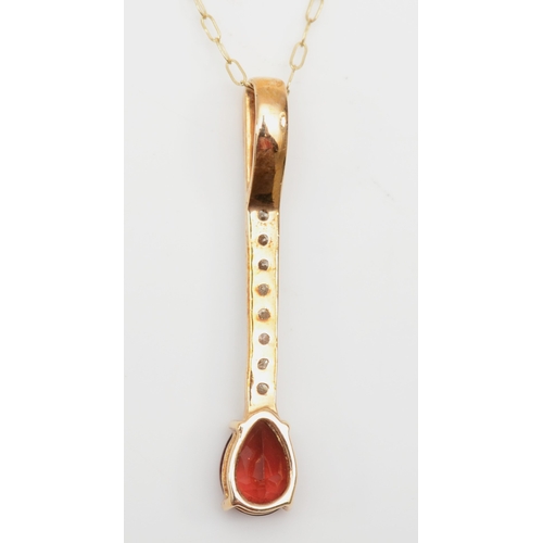 268 - An unmarked gold garnet and brilliant cut diamond drop pendant on chain, 28mm, 1.4gm.