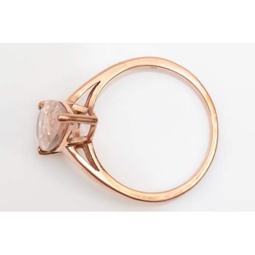 269 - A 9ct rose gold pear cut morganite dress ring, O, 2.4gm.