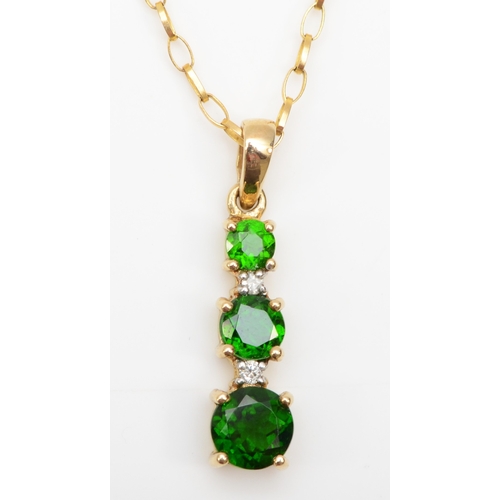 273 - A 9ct gold diopside and diamond pendant on chain, 21mm, 1.8gm.