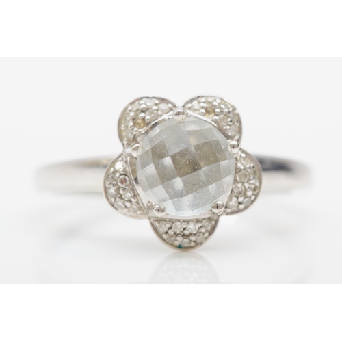 275 - A 9ct white gold quartz and diamond floral dress ring, T, 2.8gm.