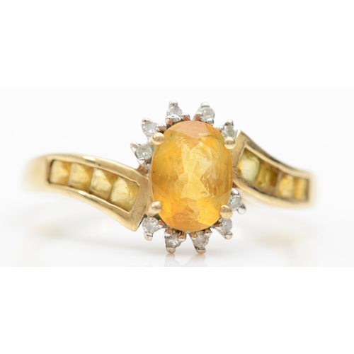 276 - A 9ct gold citrine and diamond dress ring, T, 2.7gm.