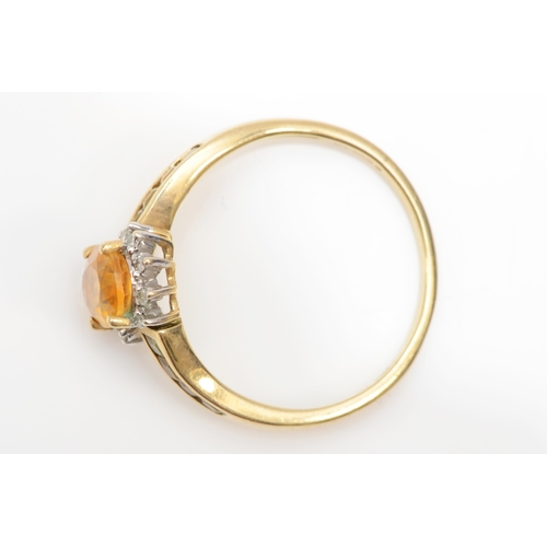 276 - A 9ct gold citrine and diamond dress ring, T, 2.7gm.