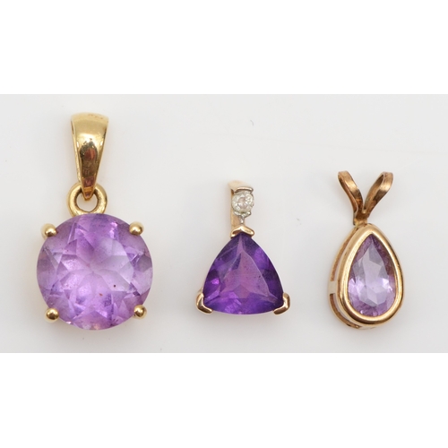 279 - Two 9ct gold amethyst pendants, with a 9k gold amethyst pendant, 3.1gm.