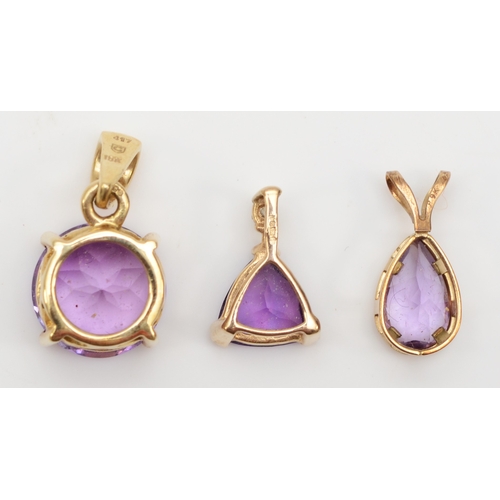 279 - Two 9ct gold amethyst pendants, with a 9k gold amethyst pendant, 3.1gm.