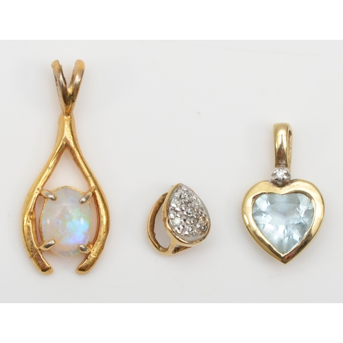 281 - A 9ct gold topaz and diamond heart shaped pendant, 14 x 8mm, together with two unmarked gold opal an... 