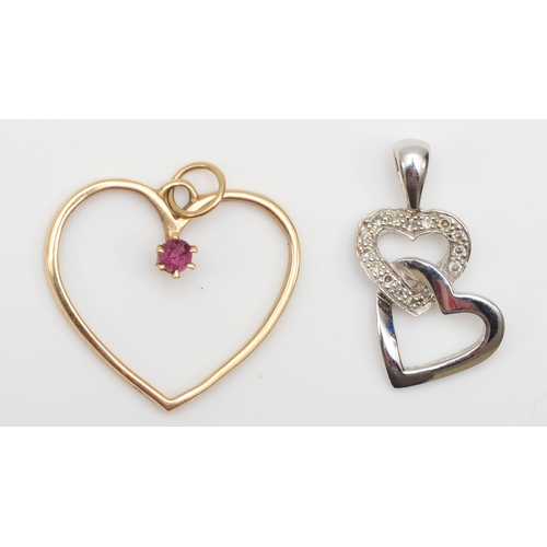 282 - A 9ct white gold diamond heart shaped pendant, 20 x 10mm, with a 9ct gold ruby heart shaped pendant,... 