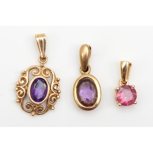 283 - A 9ct gold amethyst drop pendant, 16mm, together with two unmarked gold amethyst and pink tourmaline... 