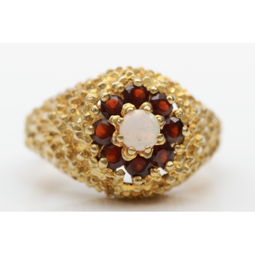 284 - An unmarked gold opal and garnet dress ring, K, 5.3gm.