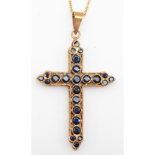 287 - A 9ct gold synthetic ruby and sapphire cross pendant, 34 x 22mm, on chain, 2.5gm.