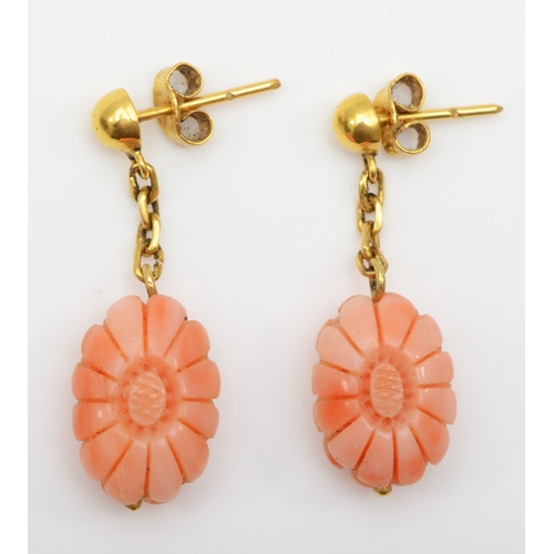 291 - A pair of unmarked gold carved floral coral drop earrings, 33mm, 5.1gm.