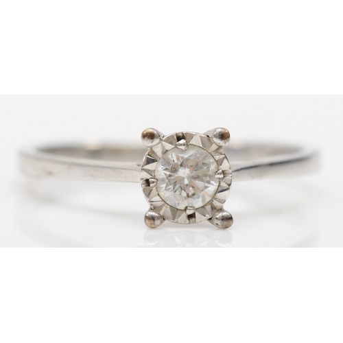 293 - A 9ct white gold illusion set brilliant cut diamond ring, stated weight 0.20, L, 1.4gm.