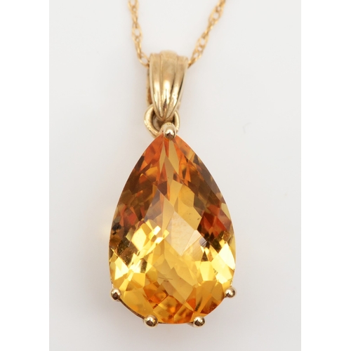 297 - A 9ct gold citrine pendant on chain, 14 x 8mm, 2.1gm.