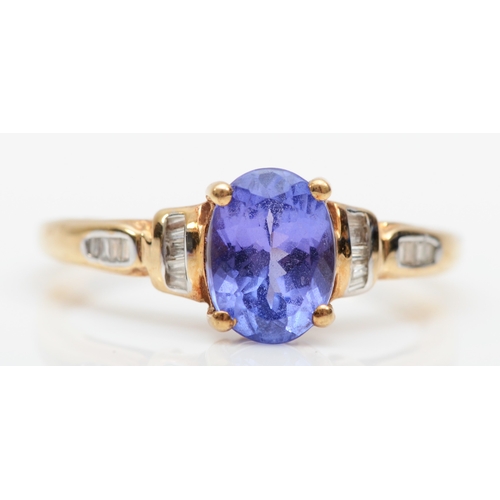 298 - A 9ct gold tanzanite and diamond dress ring, O, 2.1gm.