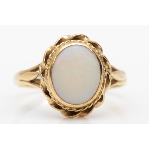 299 - An unmarked gold opal dress ring, O, 2.9gm.