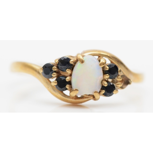 305 - A 9ct gold opal and sapphire dress ring, M, 1.4gm.