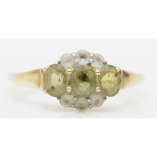 312 - A 9ct gold peridot and white stone cluster ring, T, 2.5gm.