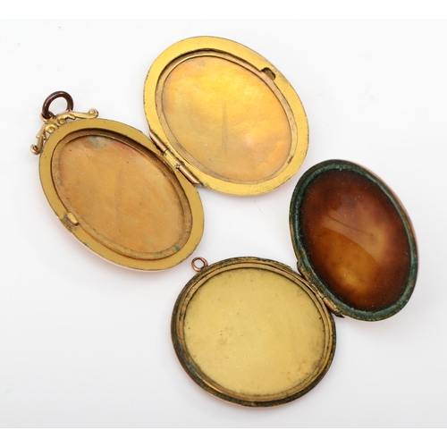 315 - A 9ct gold front and backed oval locket with chased decoration, 40 x 27mm, together with a similar r... 