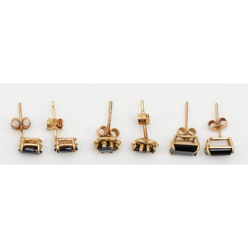 322 - A pair of 9ct gold sapphire stud earrings, 6 x 4mm, together with two pairs of unmarked gold onyx an... 