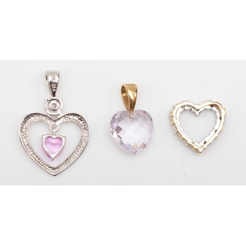 325 - A 375 white gold pink stone and diamond heart shaped pendant, 23 x 15mm, with two other unmarked gol... 