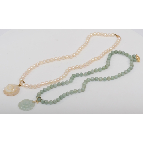 329 - A 14k gold clasped jade beaded necklace and carved floral pendant, 24mm, together with a matching pe... 