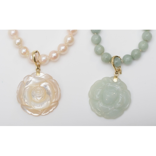 329 - A 14k gold clasped jade beaded necklace and carved floral pendant, 24mm, together with a matching pe... 