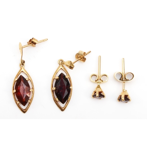 330 - A pair of unmarked gold nevette garnet drop earrings, 23mm, with a pair of unmarked gold garnet stud... 