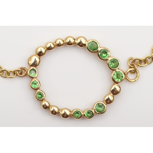 331 - A 375 gold green garnet bracelet, 21cm, 3.8gm.