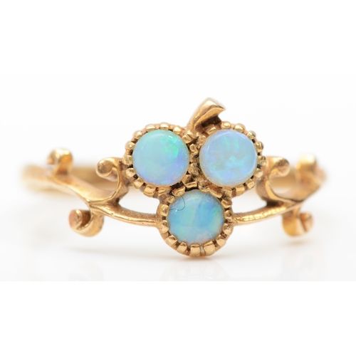 339 - A 9ct gold opal clover dress ring, with scroll decorated setting, N, 1.7gm.