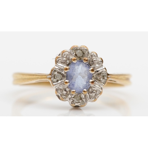 349 - A 9ct gold tanzanite and diamond cluster ring, L-M, 2gm.