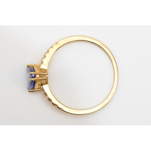 351 - A 9ct gold trillion cut tanzanite and diamond ring, O, 1.5gm.