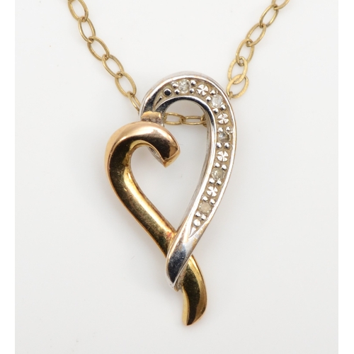 355 - A 9ct white and yellow gold heart shaped pendant set with diamonds, on chain, 10 x 19mm, 1.4gm.