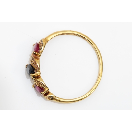 356 - A 9ct gold three stone ruby and sapphire dress ring, P, 1.6gm.